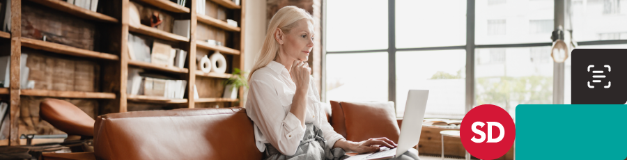 looking into her  computer screen and reading about the Importance of CompTIA® Certifications